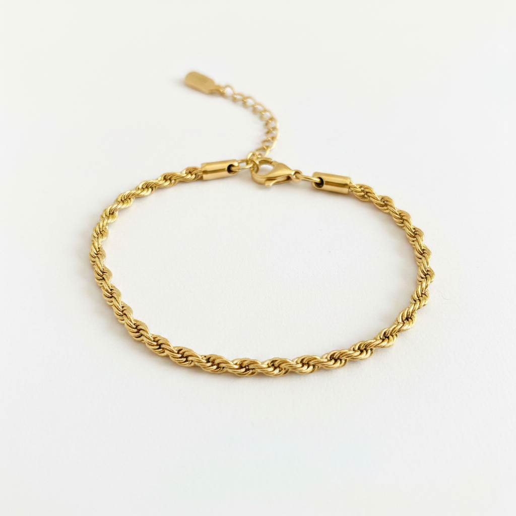 Gold rope chain bracelet on white background, product photo