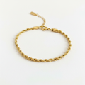 Gold rope chain bracelet on white background, product photo